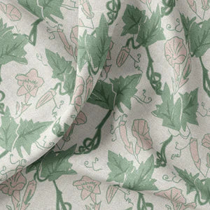 Bindweed Pink Trumpet linen by Annika Reed in green and pink, draped, showing trailing bindweed flowers
