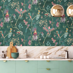 Birds in Paradise wallpaper by Brand McKenzie in teal, tropical birds on blossoming branches above a sideboard