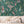 Birds in Paradise wallpaper by Brand McKenzie in teal, tropical birds on blossoming branches above a cabinet