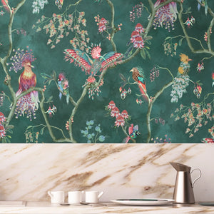 Birds in Paradise wallpaper by Brand McKenzie in teal, tropical birds on blossoming branches above a cabinet