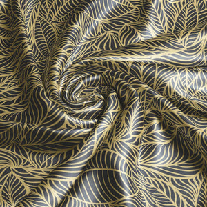 Agnes Lustre velvet by Tatie Lou in black and gold, draped, showing swirling wave lines