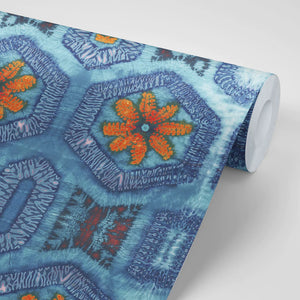 Nui Burst wallpaper by Tatie Lou in blue and orange, roll showing shibori-style bursts