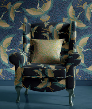 Pachamama velvet by Tatie Lou in navy, flying cranes on an upholstered chair