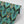 Soltar wallpaper by Tatie Lou in teal, roll showing a Deco arch pattern