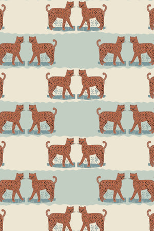 A Leopard Never Changes His Spots wallpaper by Annika Reed in orange and mint green, full repeat of leaping leopards