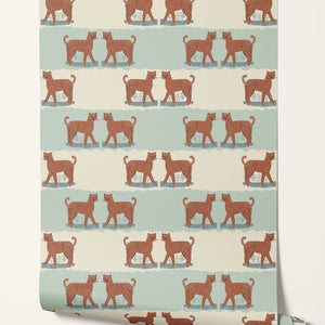 A Leopard Never Changes His Spots wallpaper by Annika Reed in orange and mint green, roll showing leaping leopards