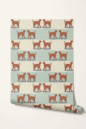 A Leopard Never Changes His Spots wallpaper by Annika Reed in orange and mint green, roll showing leaping leopards