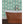 Branch of Mango wallpaper by Annika Reed in teal, mango branches in a bathroom