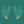 Branch of Mango wallpaper by Annika Reed in teal and orange, detail of mango branches
