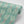 Branch of Mango wallpaper by Annika Reed in teal, roll showing mango branches