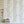 Monkeys and Birds wallpaper by St. Jude's in green, monkeys and birds on stems above a cabinet