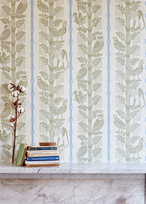 Monkeys and Birds wallpaper by St. Jude's in green, monkeys and birds on stems above a cabinet