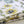 Bumblebee and Flora fabric by Seed Home Designs in yellow and green, pattern sample of bumblebees and sunflowers