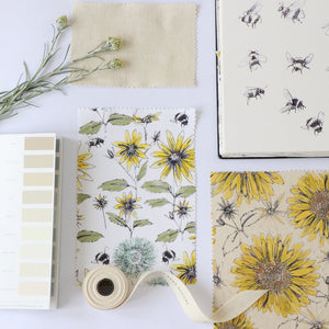 Bumblebee and Flora fabric by Seed Home Designs in yellow and green, flat sample of bumblebees and sunflowers