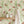 Sustainable Butterfly and wallpaper by Seed Home Designs in cream, butterflies and ferns above a sideboard