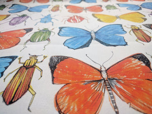 Beetle and Butterfly fabric by Seed Home Designs in red, blue and green, flat sample of watercolour beetles and butterflies