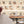 Cabin Class wallpaper by Brand McKenzie in beige, animal passengers in train windows in a home office