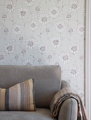 Caja Floral wallpaper by Seed Home Designs in grey, line-drawn daisies in a living room