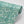 Calla Lily wallpaper by Annika Reed in green and white, roll showing calla lilies