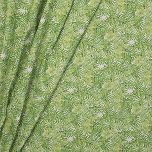 Canopy linen by Bethie Tricks in green, draped, showing palm fronds