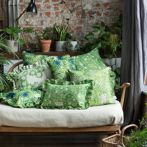 Canopy linen by Bethie Tricks in green, palm fronds upholstered on an armchair