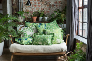 Canopy linen by Bethie Tricks in green, palm fronds upholstered on an armchair