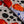 Cellular linen by Bethie Tricks in orange and black, flat sample of bold cell shapes
