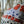 Cellular linen by Bethie Tricks in orange and black, bold cell shapes made into a cushion