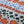 Cellular linen by Bethie Tricks in orange and black, draped, showing bold cell shapes