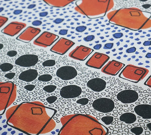 Cellular linen by Bethie Tricks in orange and black, draped, showing bold cell shapes