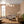 Blossom wallpaper by Dami and Em Design in pink, blossom branches in a living room