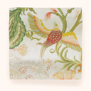 Chintz 21 linen by Parker and Jules in cream and pink, draped, showing a chintz of birds and flowers
