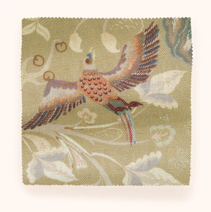 Chintz 21 linen by Parker and Jules in beige, in soft folds showing a chintz of birds and flowers