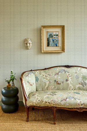 Chintz 21 linen by Parker and Jules in cream and red, a chintz of birds and flowers in a living room