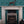 Chattering of Choughs wallpaper by Annika Reed in teal, choughs among leaves around a fireplace