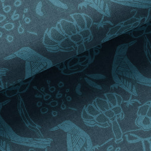 Chattering of Choughs linen by Annika Reed in teal, draped, showing choughs among leaves