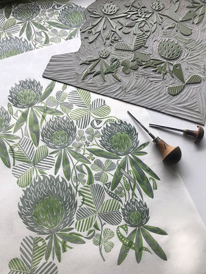 Clover wallpaper by St. Jude's in pale green, flat sample of clover leaves and flowers