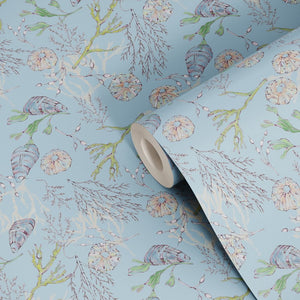 Coastal Cove wallpaper by Seed Home Designs in blue, roll showing line-drawn shells and seaweed
