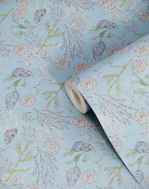Coastal Cove wallpaper by Seed Home Designs in blue, roll showing line-drawn shells and seaweed