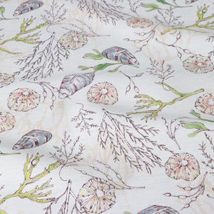 Coastal Cove fabric by Seed Home Designs in beige, full repeat of line-drawn shells and seaweed