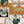Connecting Frames wallpaper by Brand McKenzie in caramel, close view of a gallery wall of framed portraits