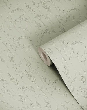Cornish Meadow wallpaper by Seed Home Designs in green, partly unrolled roll showing fine meadow grasses