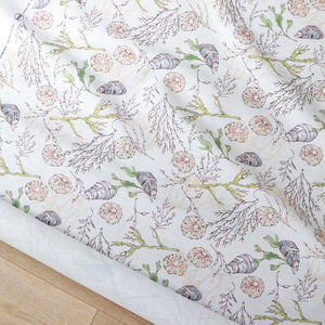 Coastal Cove fabric by Seed Home Designs in beige, pattern sample of line-drawn shells and seaweed