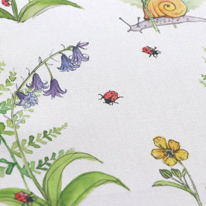 Cornish Woodland fabric by Seed Home Designs in green and orange, pattern sample of woodland flowers and creatures