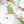 Cornish Woodland fabric by Seed Home Designs in green and orange, flat sample of woodland flowers and creatures