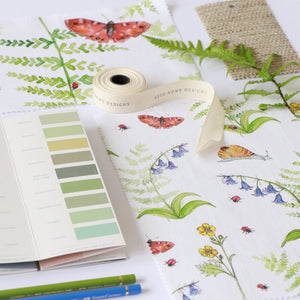 Cornish Woodland fabric by Seed Home Designs in green and orange, full repeat of woodland flowers and creatures