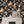 Cosmic Groove wallpaper by Brand McKenzie in charcoal, retro figures floating in space around a fireplace