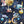 Cosmic Groove wallpaper by Brand McKenzie in navy, detail of retro figures floating in space