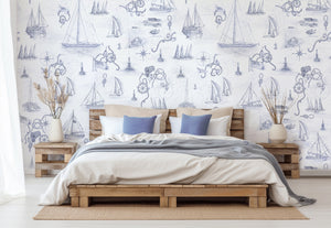 Cowes wallpaper by XV Interiors in blue, sailing boats and anchors behind a bed