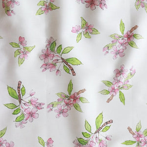 Crab Apple Blossom fabric by Seed Home Designs in pink and green, flat sample of crab apple blossom sprigs
